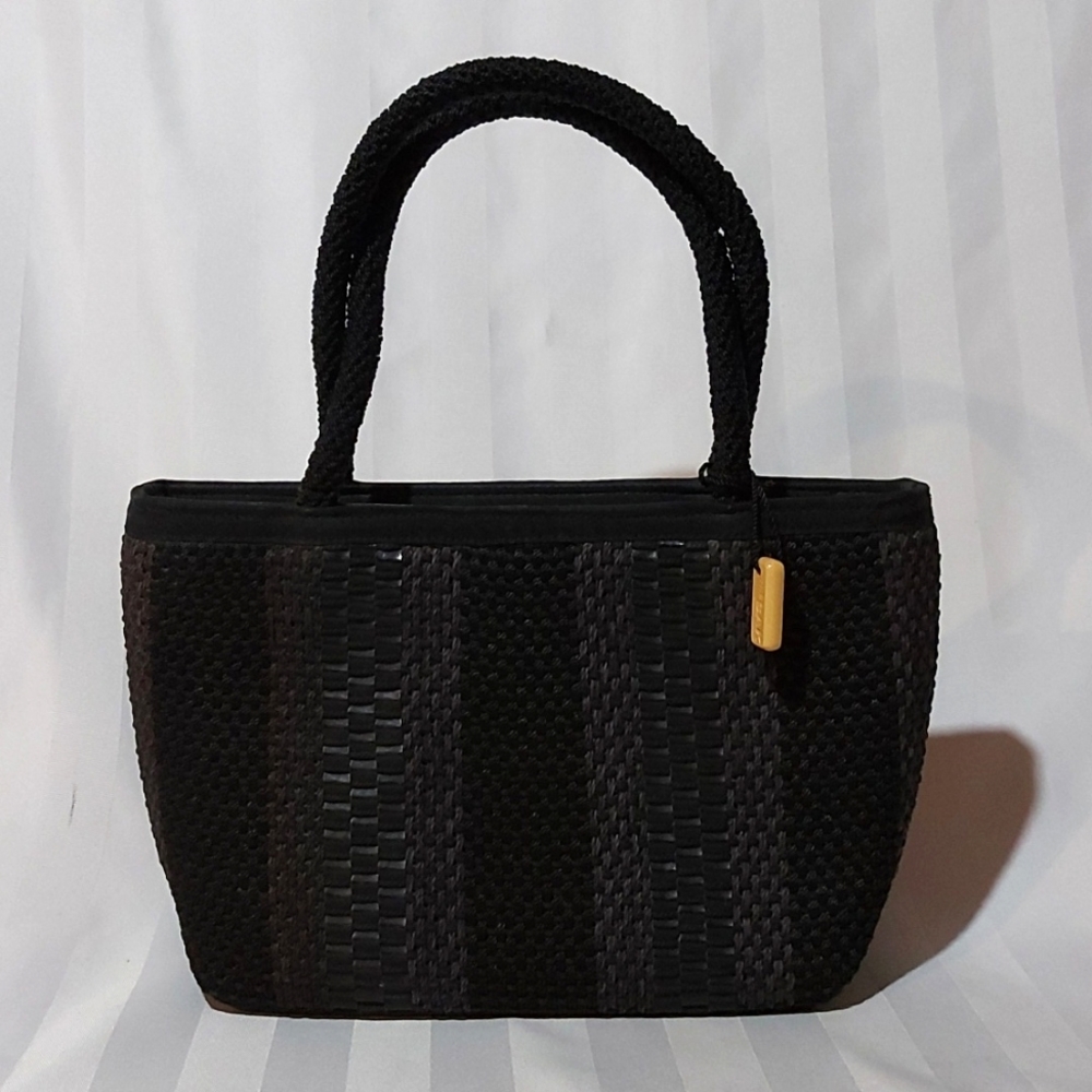 22. THE SAK LEATHER WOVEN HANDBAG!